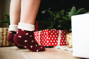 Girl standing by the christmas tree